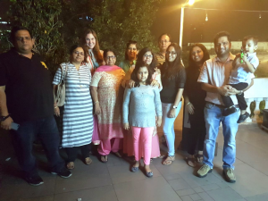 Kate Kumar stands for a group photo with several family members
