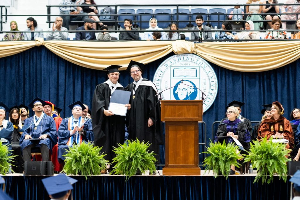 Professor Dean Smith receives the CPS Faculty Excellence Award, Commencement, 2023
