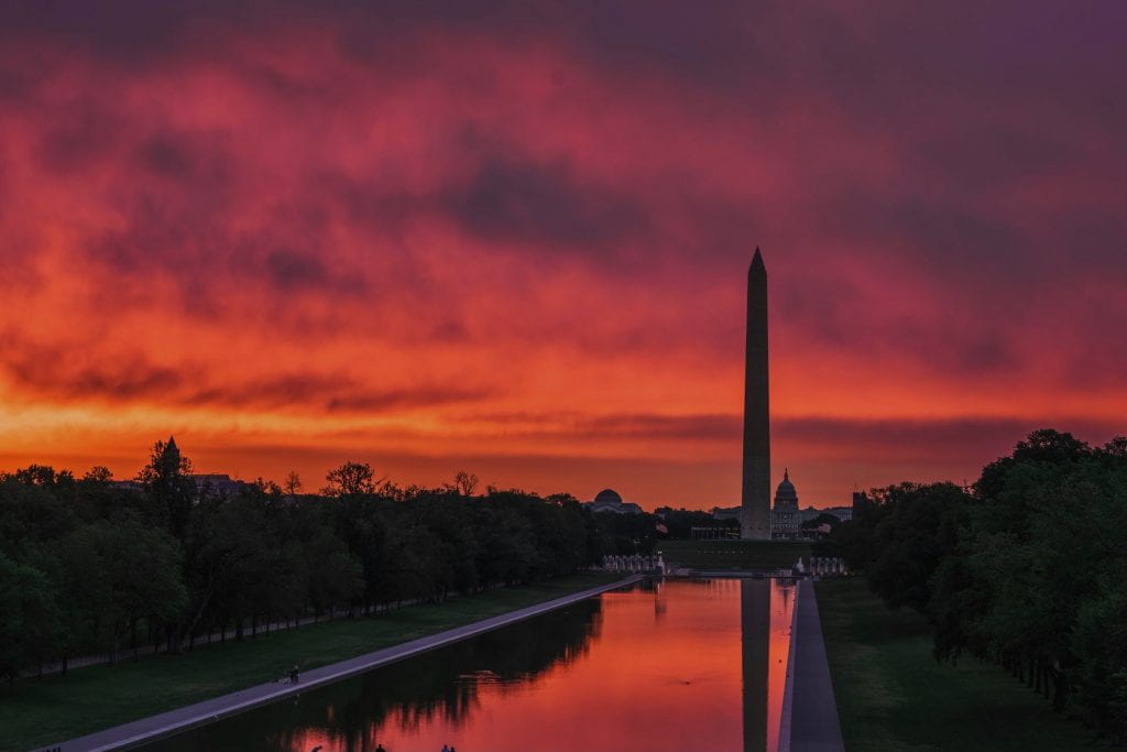Washington monument at sunrise witha red sky