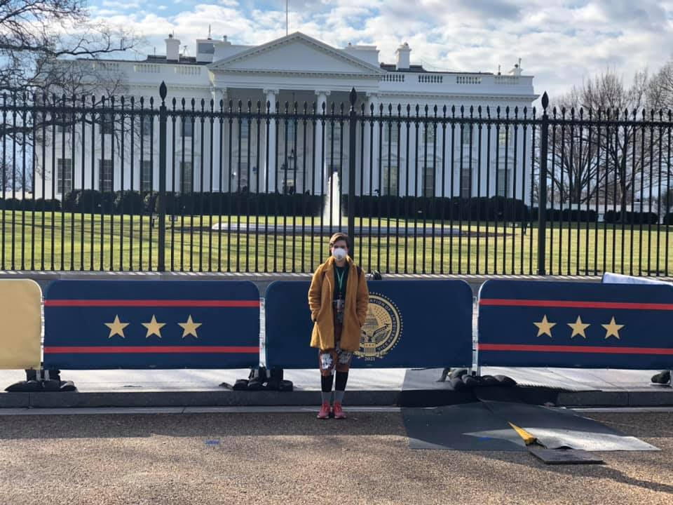 volunteer in front of white house