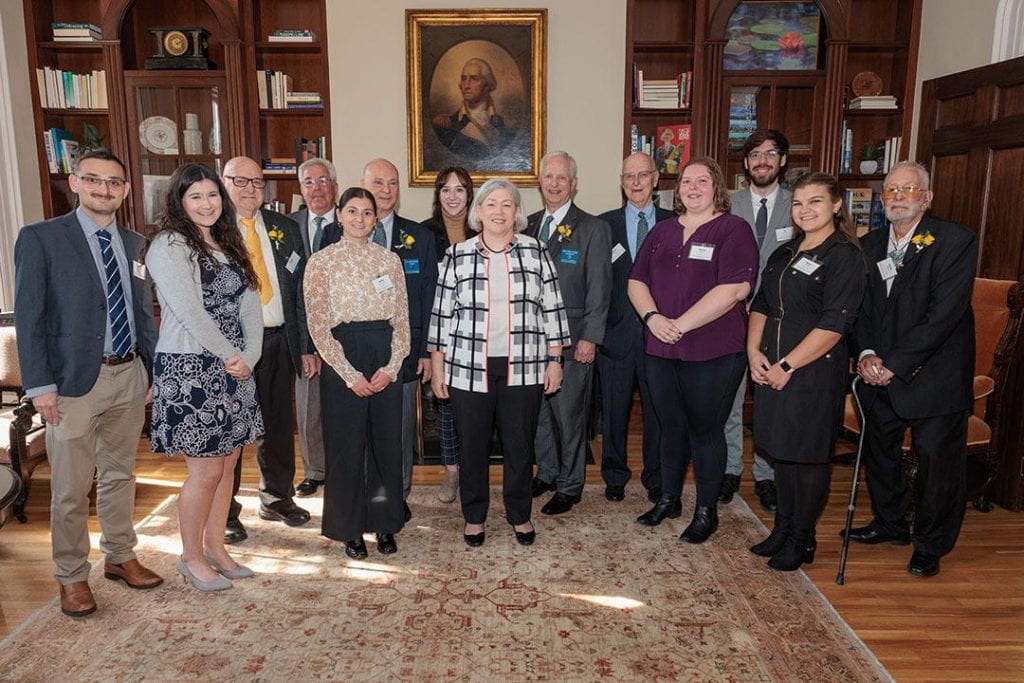 President Granberg (c) with current Wolcott Foundation fellows and trustees of the Wolcott Foundation. (William Atkins/GW Today)