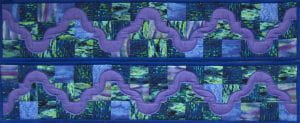 Multicolored rectangular quilt in purple, blue, and green tones. Titled "Drunkard's Path," created by Velma Jordan.