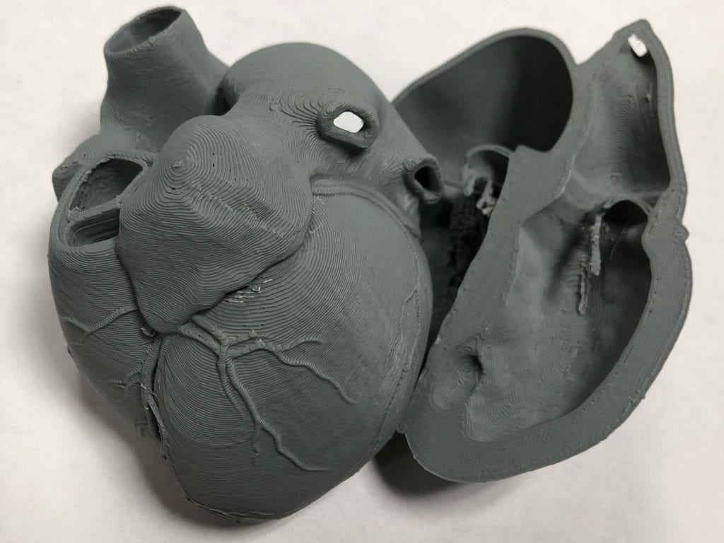 Picture of a gray 3D printed heart.