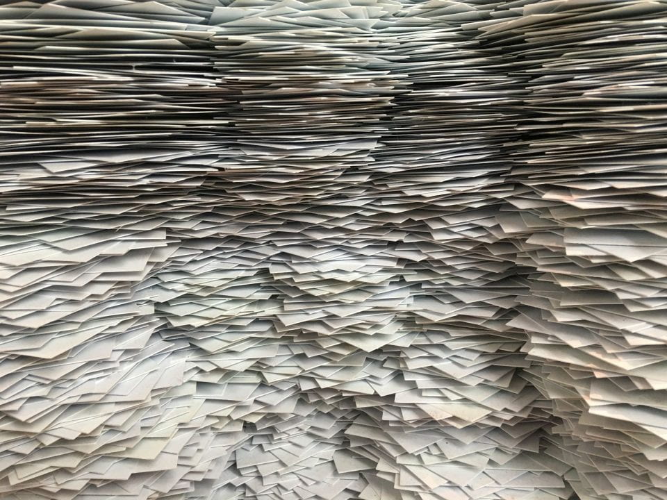 Decorative image of stacks of paper.
