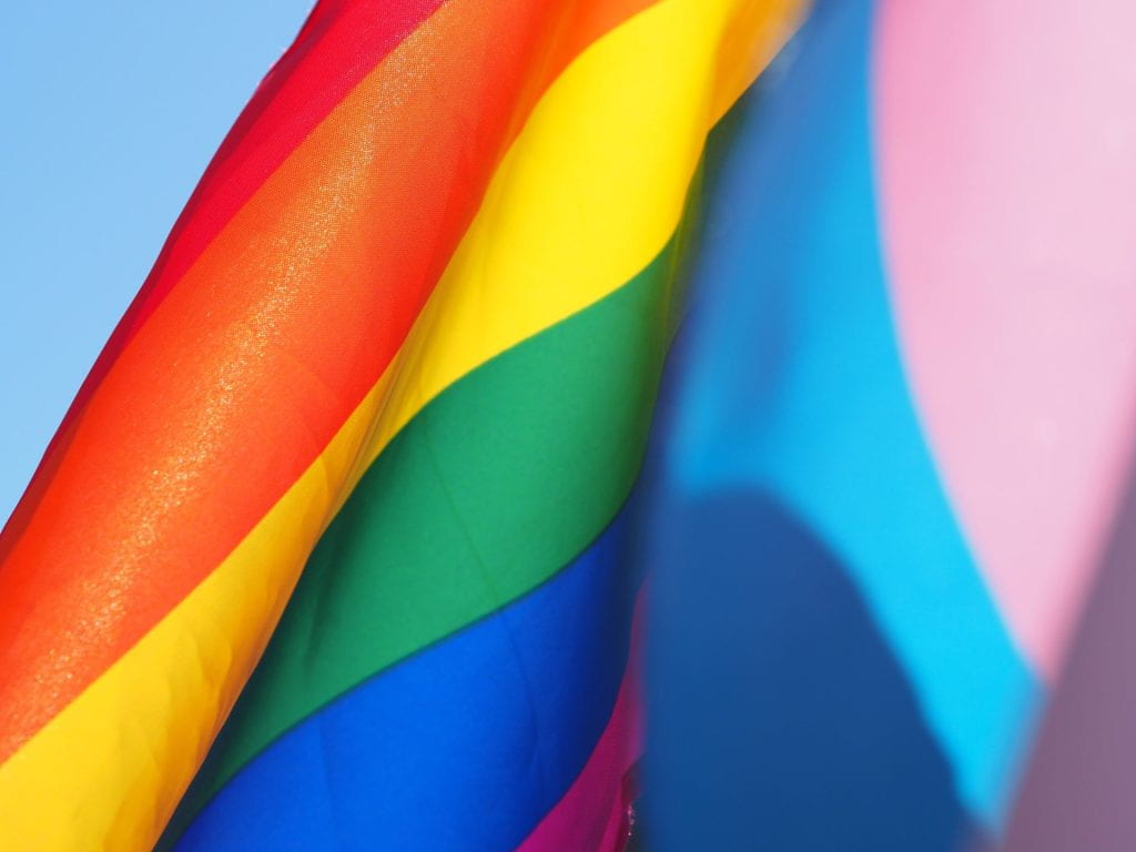 Close up image of a rainbow Pride flag.