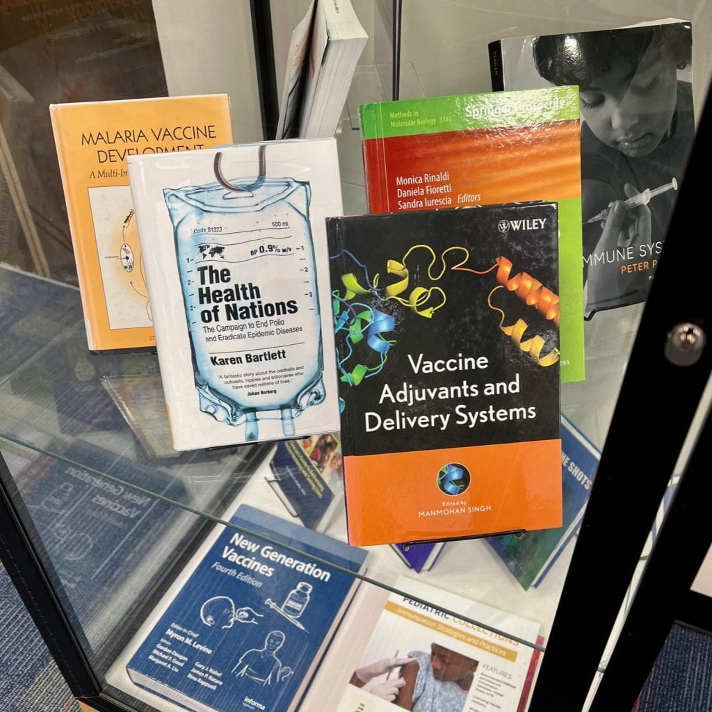 Picture of books on immunization on display in Himmelfarb's display case.