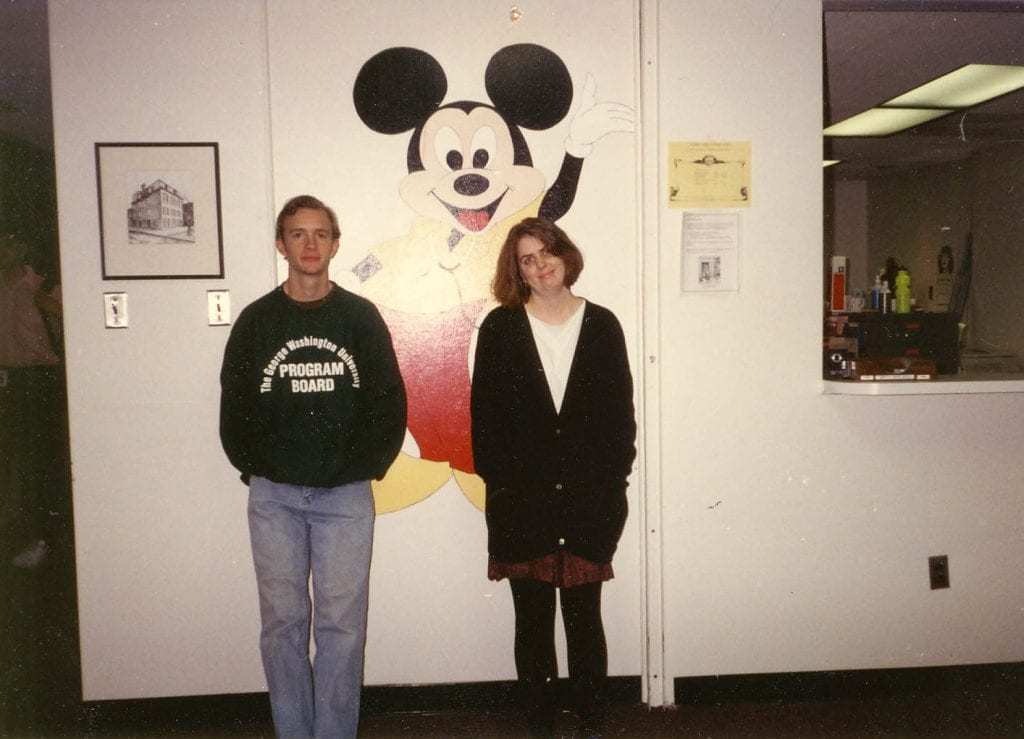 Catherine posing with Josh and Himmelfarb’s old Mickey Mouse painting.