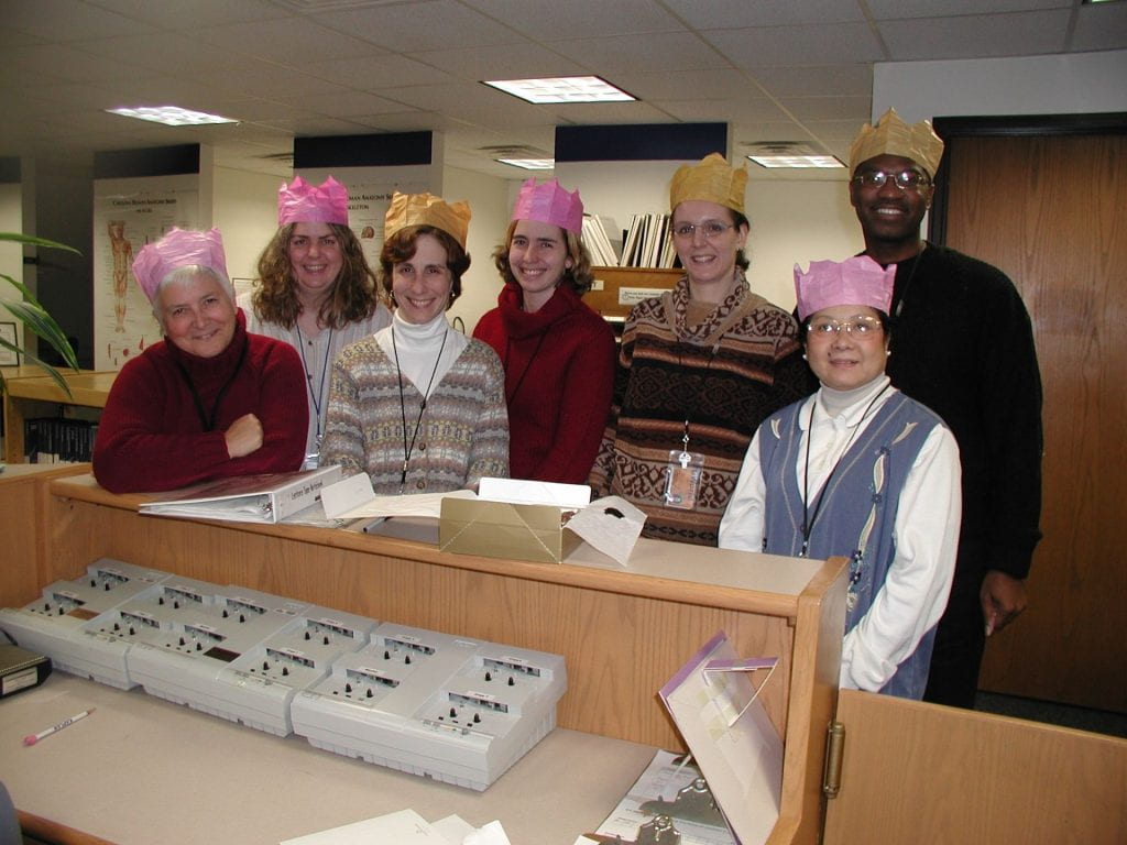 Catherine posing with other “Crowned Heads of State” Himmelfarb staff members.