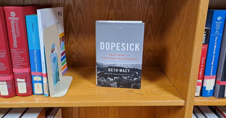 Picture of a copy of Dopesick on the shelf.
