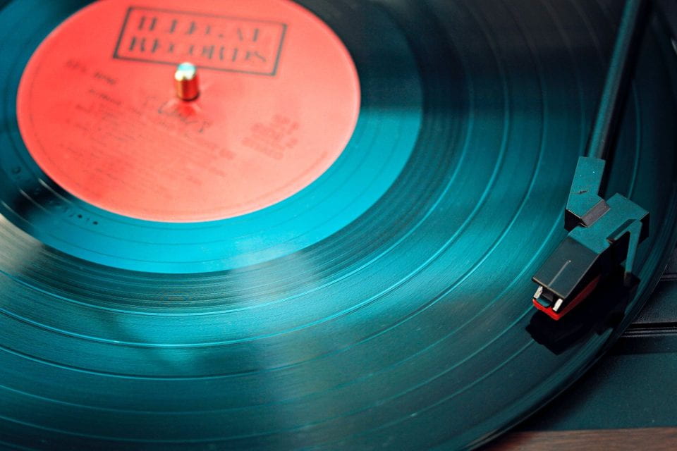 Photo of a record on a record player.