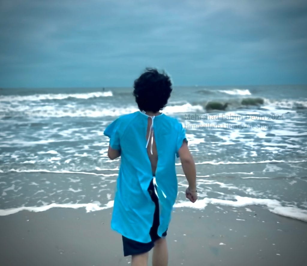 Photograph of a person wearing a medical gown running towards the ocean waves on a beach.