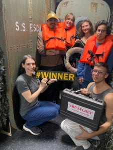 students from the 'Games' Capstone successfully completing their escape room. 