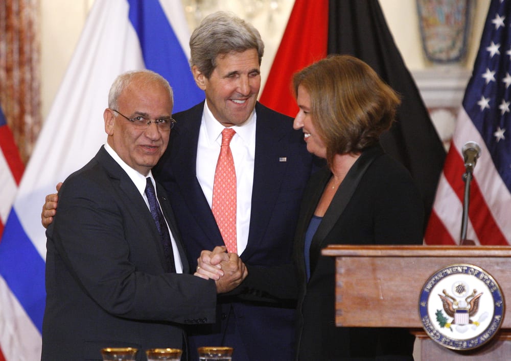 Chief Palestinian negotiator Saeb Erekat (L-R), U.S. Secretary of State John Kerry and Israel's Justice Minister Tzipi Livni shake hands at a news conference at the end of talks at the State Department in Washington, July 30, 2013. (Credit: Reuters via ChristianPost.com)