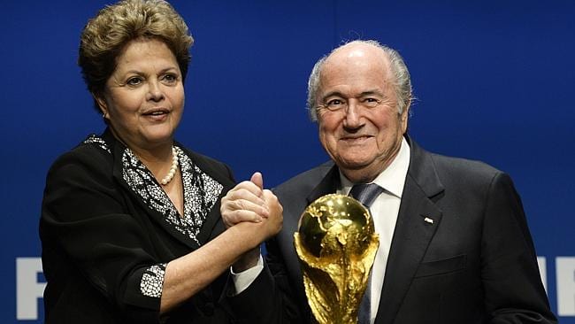 Dilma Rousseff (left) and FIFA president Sepp Blatter (right) with the World Cup trophy. Source: AP