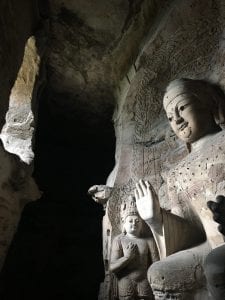 buddha statues inside a cave