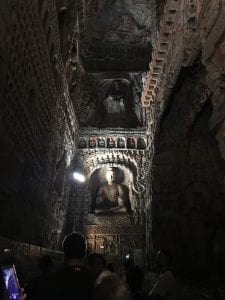 buddhist structures inside massive cave